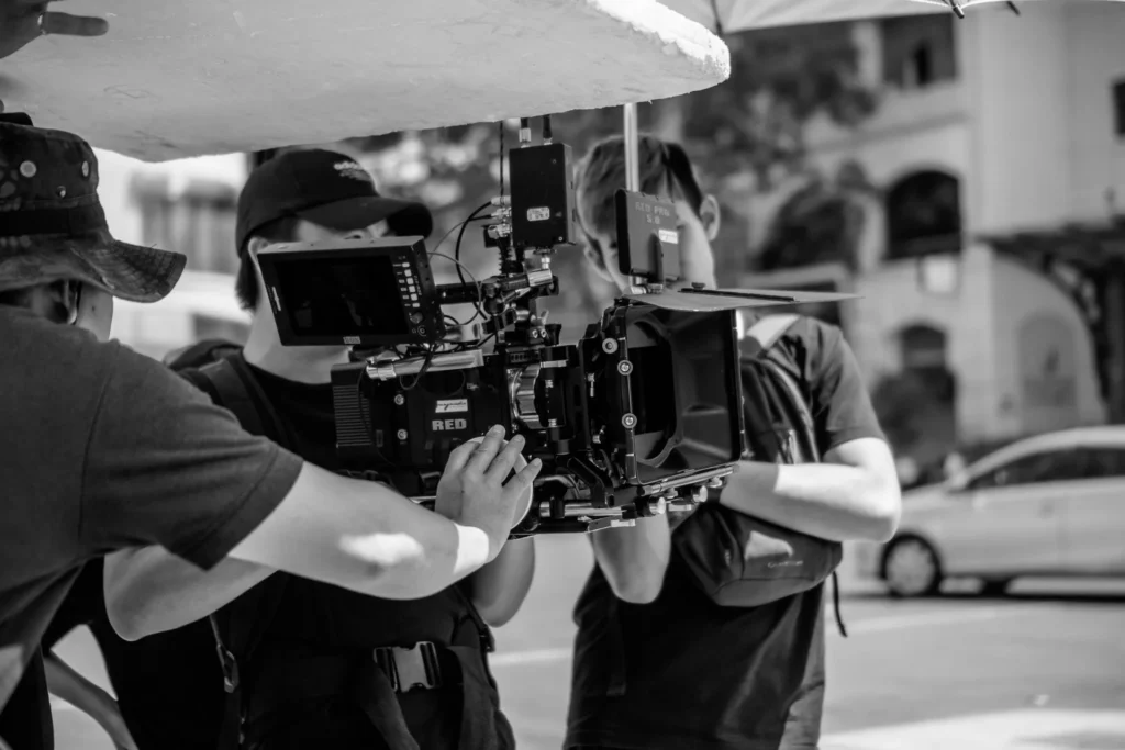 Film crew operating a cinema camera on a city street