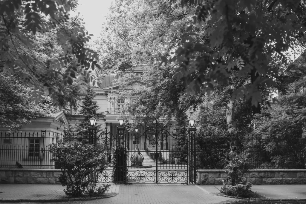 Private mansion behind a wrought iron fence and gate