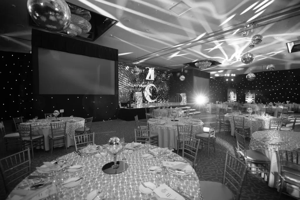 Event hall set with dinner tables for a private party