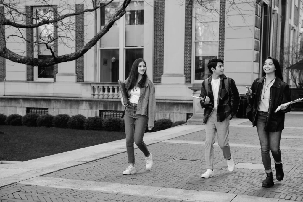 Students walking across a university campus